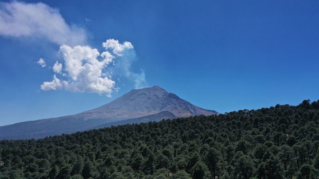 a mountain with a cloud in the sky